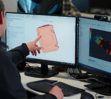 Engineering team designing advanced thermal management solutions and coldplates for AI data centers using CAD software and thermal simulation.